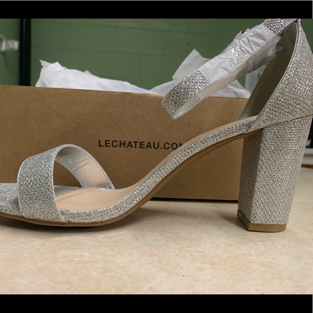 NEW, Never worn Le Chateau Silver Heels